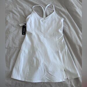 TNA Action tennis mini dress with built in shorts.